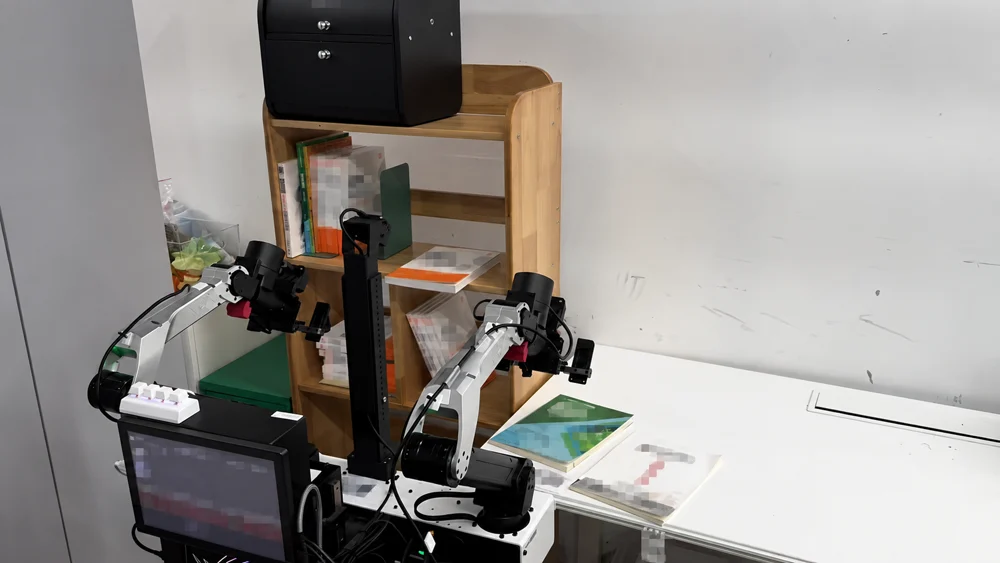 Lift-2S mobile robot arranging books between a desk and shelf
